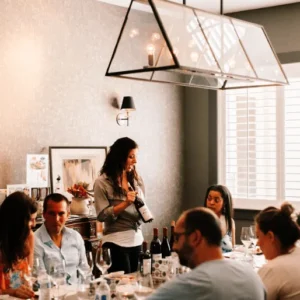 Group enjoying wine tasting dinner at Masia de la Vinya