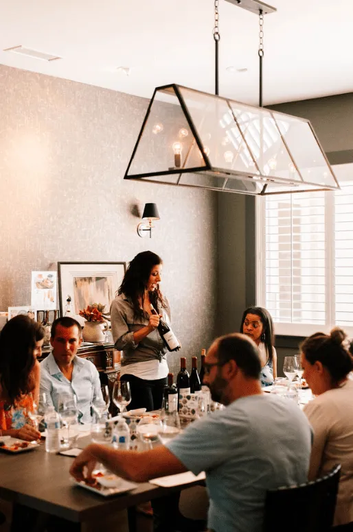 Group enjoying wine tasting dinner at Masia de la Vinya